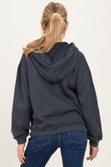 woman wearing a dark gray maternity hoodie with a loose fit, seen from the back with a ponytail hairstyle