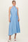 woman wearing a light blue pleated midi dress with a halter neck and a tie waist detail