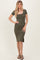 woman wearing an olive green ribbed midi dress with short sleeves and a scooped neckline