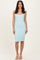 woman wearing a light blue ribbed midi dress with spaghetti straps and a scooped neckline