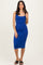 woman wearing a bodycon bright blue midi dress and flat sandals