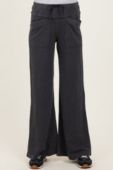 maternity wear in dark gray wide-leg pants with drawstring and front pockets, styled with a casual top