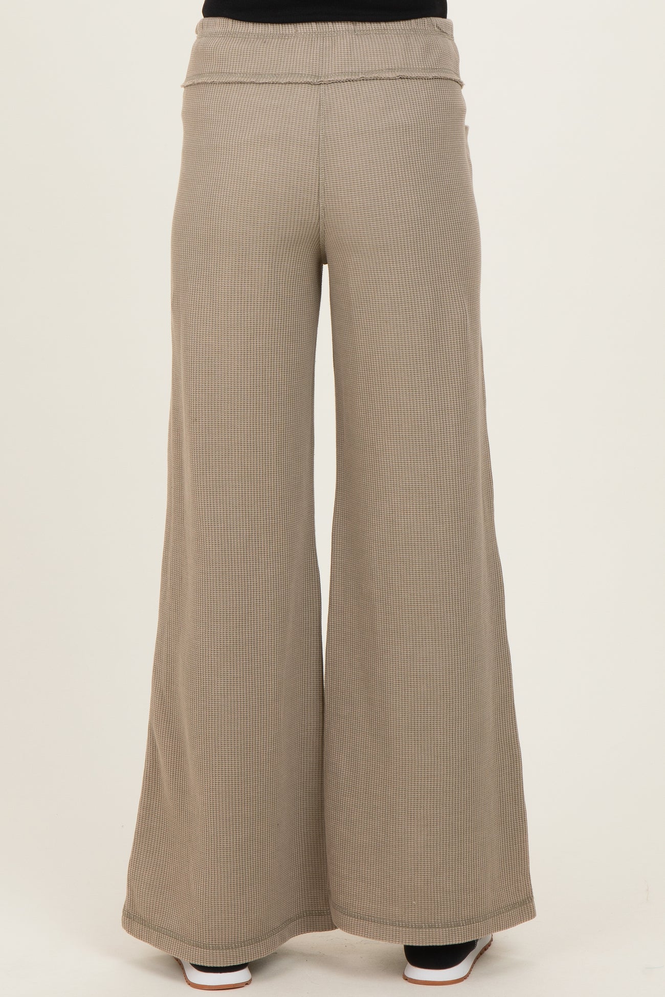 maternity wide leg ribbed pants in a light taupe color, featuring a comfortable waistband, shown from the back