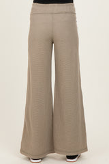 maternity wide leg ribbed pants in a light taupe color, featuring a comfortable waistband, shown from the back