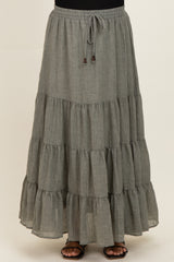 maternity wear tiered gray maxi skirt with an elastic waistband and drawstring detail, model standing and wearing sandals