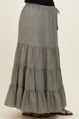 woman wearing a gray tiered maternity maxi skirt with an elastic drawstring waistband