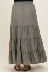 maternity wear gray tiered maxi skirt with elastic waistband, model facing away, showing full length and flowy design