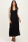 woman wearing a black sleeveless maxi dress with a gathered bodice and side slits