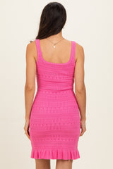 woman wearing a hot pink knit bodycon dress with a ruffled hem and a fitted silhouette