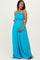 woman wearing a bright blue maternity maxi dress with a smocked bodice and cut-out detail, showing her baby bump