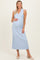 woman wearing a light blue ribbed maternity dress with a v-neck and a visible baby bump