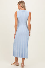 woman wearing a light blue sleeveless ribbed maternity dress that falls to mid-calf