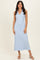 woman wearing a light blue ribbed sleeveless midi dress with a v-neckline and side slits
