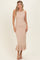 woman wearing a beige ribbed midi dress with a flounce hem and sleeveless design