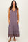 woman wearing a purple printed maxi dress with a v-neckline and tiered skirt