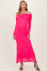 woman wearing a hot pink off-the-shoulder long sleeve maternity dress with a fitted silhouette and a baby bump visible