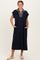 woman wearing a navy midi dress with a striped collar, featuring short sleeves and side pockets