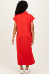 woman wearing a red maxi dress with short sleeves and a collar, seen from the back