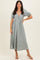 woman wearing a light grey puff sleeve midi dress with a v-neck and gathered detail