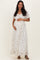 woman wearing a floral print maternity maxi dress and holding her baby bump