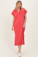 woman wearing a coral midi dress with cap sleeves and a v-neckline, styled with white sneakers