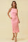 woman wearing a fitted pink ribbed midi dress with a scoop neckline and a slight slit at the hem