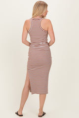 woman wearing a brown and white striped tank midi dress with a side slit, shown from the back