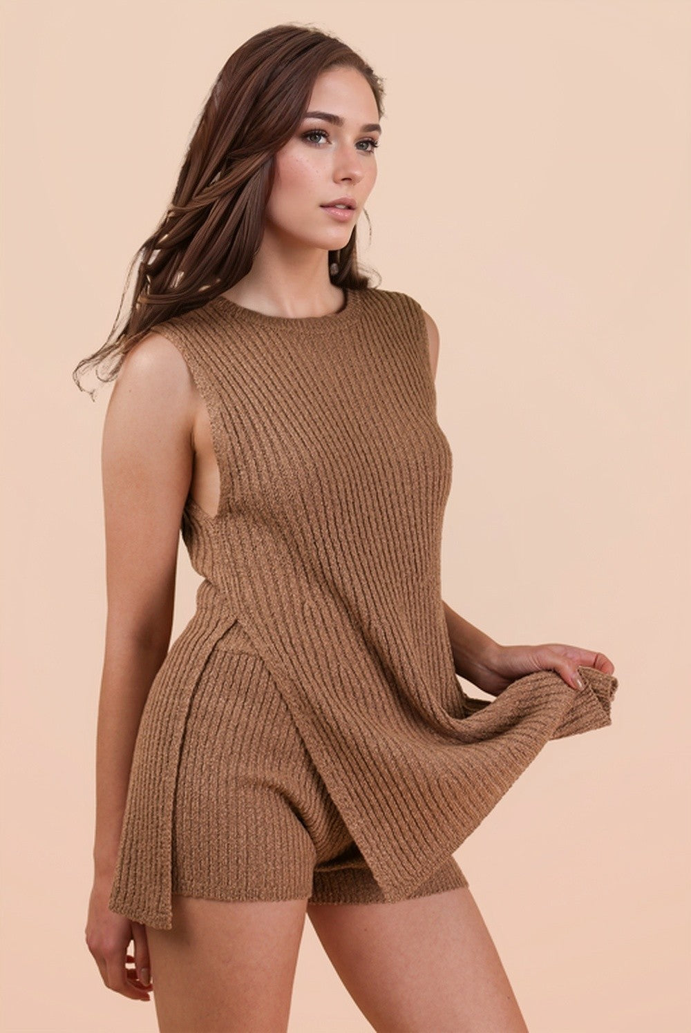 woman wearing a tan ribbed knit sleeveless top and matching shorts