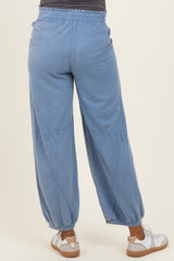 woman wearing light blue maternity jogger pants with a relaxed fit and elastic waistband from the back