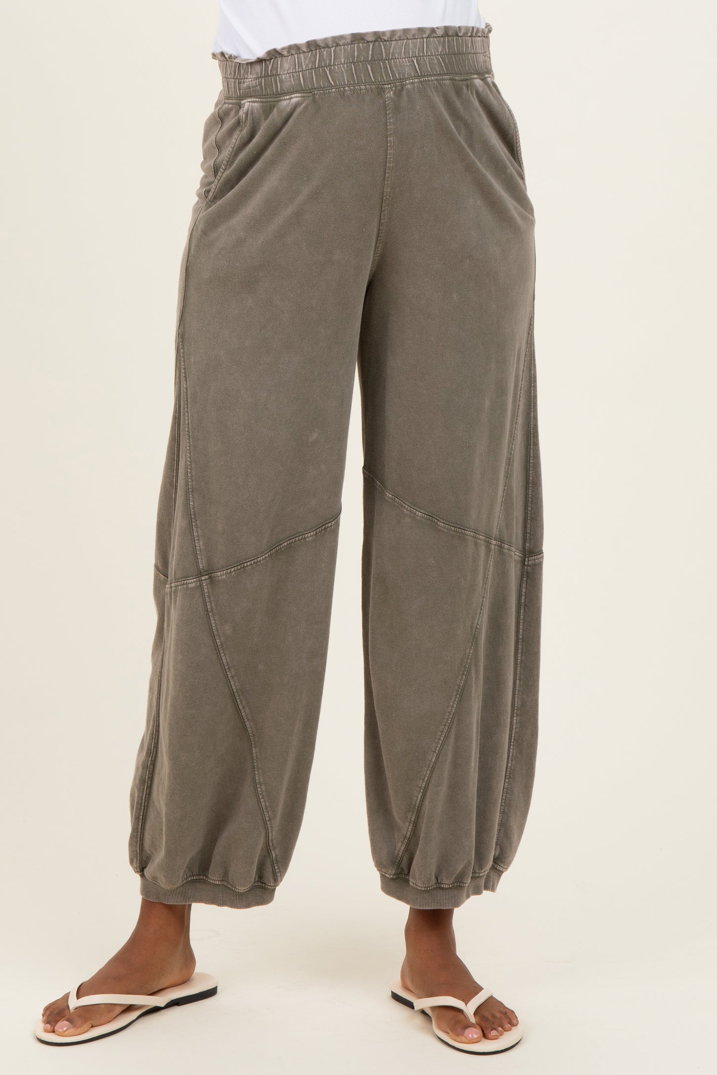 woman wearing light gray maternity wide-leg pants with elastic waistband and gathered cuffs