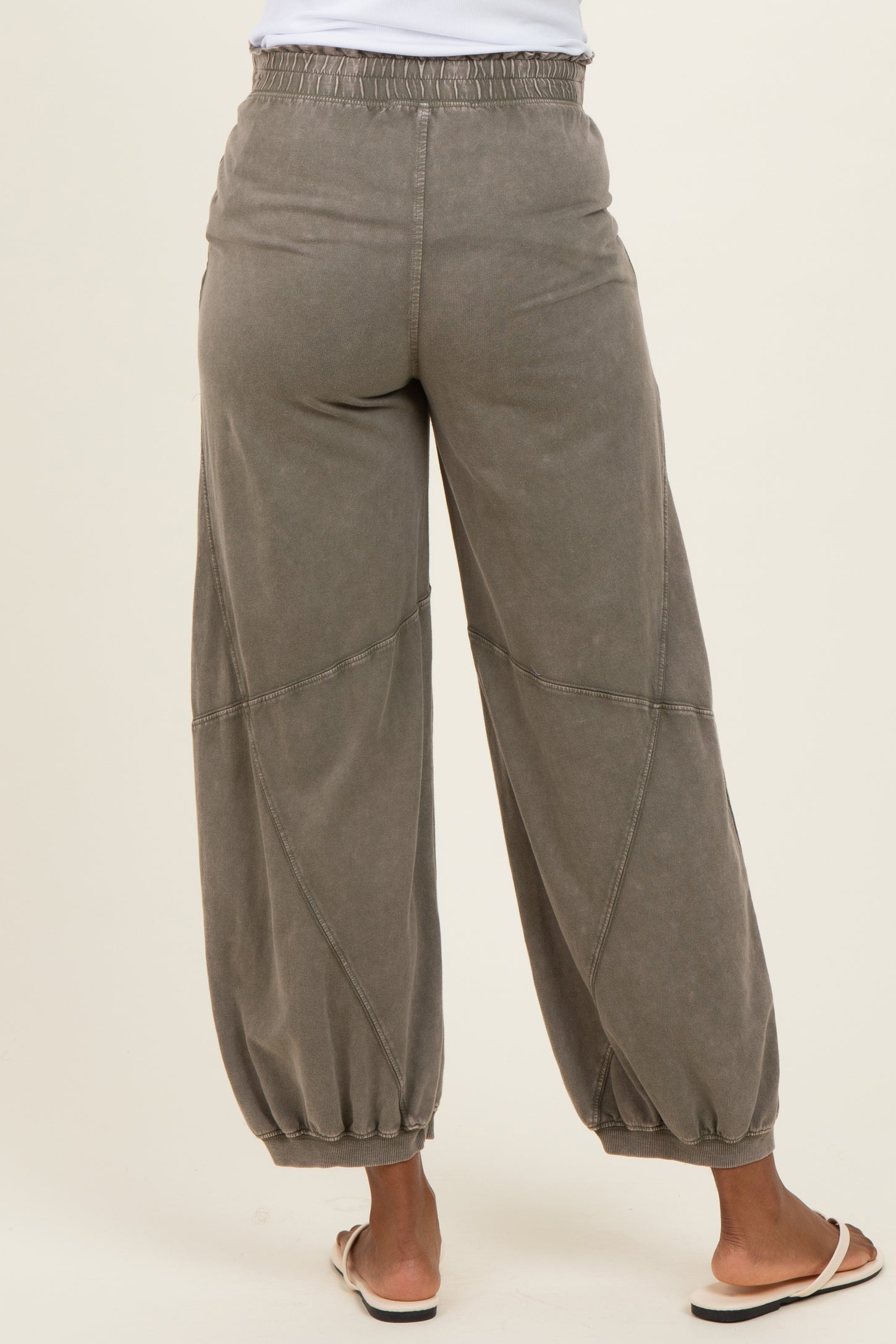 woman wearing gray maternity jogger pants with a relaxed fit and gathered cuffs, view from the back