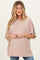 woman wearing a taupe oversized maternity t-shirt and showing her baby bump