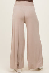 maternity wear in soft beige wide-leg pants featuring an elastic waistband