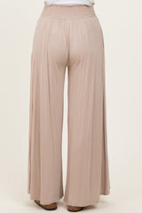 light beige wide-leg pants with an elastic waistband, viewed from the back