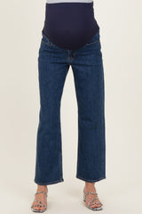 maternity wear dark blue straight leg jeans with a stretchy over-the-bump panel, model wearing high-heeled sandals