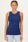 woman wearing a navy blue sleeveless ribbed top with a round neckline and light blue jeans