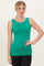 woman wearing a bright green sleeveless top paired with black leggings