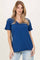 woman wearing a navy blue short sleeve v-neck t-shirt with relaxed fit and casual style