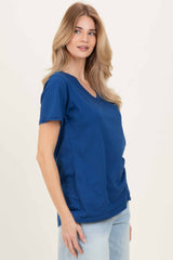 woman wearing a navy blue v-neck t-shirt with short sleeves and relaxed fit