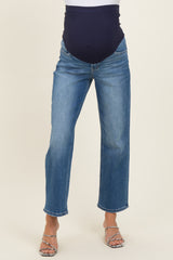 woman wearing maternity dark blue panel straight leg jeans with a light blue wash, showing no baby bump