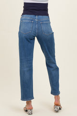 woman wearing a pair of blue maternity jeans, showing the back view with a stretchy waistband