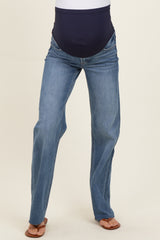 woman wearing a pair of blue maternity jeans with a navy belly panel and flared leg style