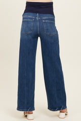 maternity wear dark wash wide leg jeans with a stretchy navy blue waistband and back pockets, model is seen from behind