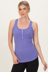 woman wearing a purple ribbed tank top with button details and a fitted silhouette