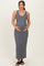 woman wearing a gray ribbed maternity maxi dress and cradling her baby bump