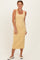 woman wearing a yellow floral midi dress with a square neckline and fitted silhouette
