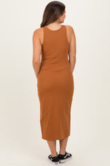 woman wearing a brown ribbed maternity tank dress, seen from the back