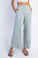 woman wearing mint green wide-leg pants with an elastic waistband and side pockets