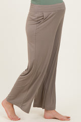woman wearing taupe maternity wide-leg pants with a comfortable elastic waistband