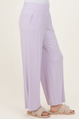 woman wearing lavender wide-leg pants with side pockets and a comfortable elastic waistband